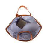Open Childhome Family Tote Bag with brown faux leather handles and trim, showing light gray lining and a small matching pouch.