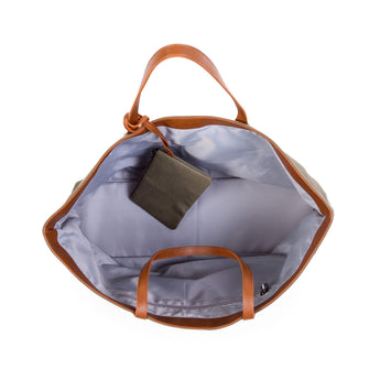 Open Childhome Family Tote Bag with brown faux leather handles and trim, showing light gray lining and a small matching pouch.