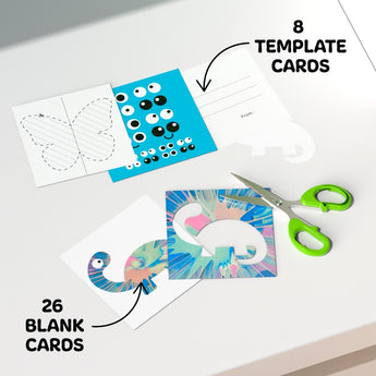 White table with 8 template cards, including a blue monster and butterfly, plus 26 blank cards and green scissors.