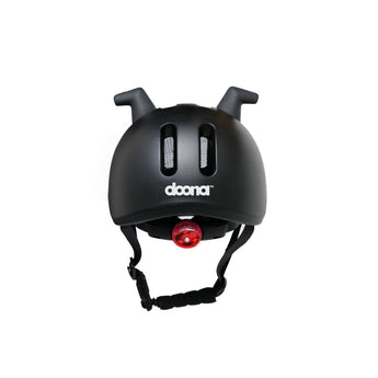 Doona Liki Helmet Black with unique silicon horns, vents, and red rear light.