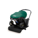 Doona Vehicle Seat Protector, a black mat under a green Doona infant car seat/stroller.