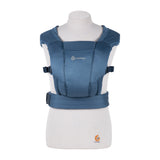 Ergobaby Embrace Heather Grey newborn carrier on a mannequin, showcasing its soft fabric and ergonomic design.