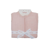 Lulujo 100% cotton muslin sleep sack in soft pink, folded and tied with a white logo ribbon.