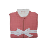Lulujo 1.0 TOG pink 100% cotton muslin sleep sack, folded and tied with a white logo ribbon.
