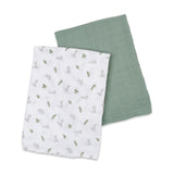 Lulujo 2-pack cotton muslin swaddles: one white with grey bunnies and green leaves, one solid sage green.