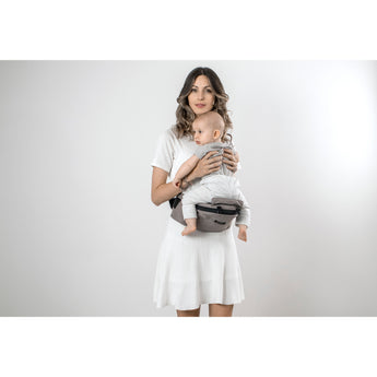 Woman holding baby in a gray MiaMily Hipster ergonomic baby carrier with hip seat.