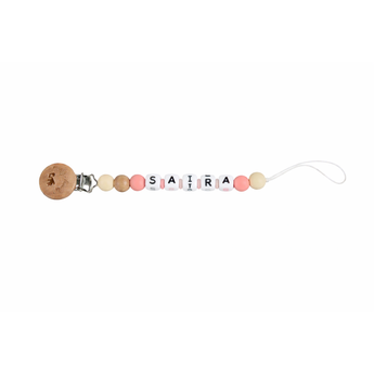 Personalized pacifier clip with pink, beige, and white silicone beads spelling "SAIRA", natural wood clip.