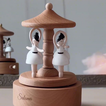 Personalized wooden music carousel with two white ballerinas, engraved with "Salama.