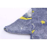 Close-up of a soft, blue My Little Thieves kids sleeping sack with yellow stars and moon designs.