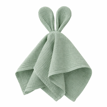 Light green cotton muslin baby comforter with bunny ears, folded.