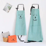 Two light blue kids bear aprons with black straps and pockets, alongside a gray and orange bear bag.