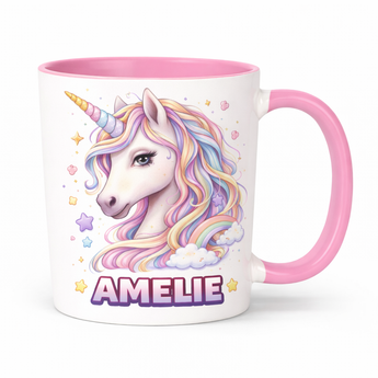 White 11 oz ceramic mug with pink handle and interior, featuring a colorful unicorn and "AMELIE" in purple.