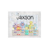 Personalized 60-piece kids puzzle with colorful robot design and the name "JAXSON" in black.