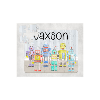 Personalized 60-piece kids puzzle with colorful robot design and the name "JAXSON" in black.
