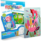 Ooly Foil-tastic art kit with 12 double-sided foil art pages, including a pink axolotl and colorful fish.