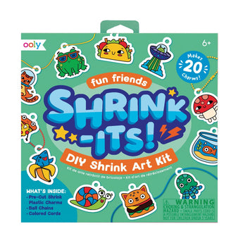 Ooly Shrink Its! DIY Shrink Art Kit box with colorful pre-cut charms like tacos, cats, and frogs.