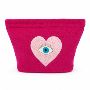 Pink pouch with a heart design featuring an eye on a white background
