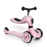 Pink Scoot & Ride Highwaykick 1 2-in-1 kickboard with seat, two front wheels, and one rear wheel.