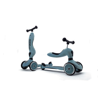 Two Scoot & Ride Highwaykick 1 scooters in light blue, one upright, one in ride-on mode.