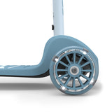 Light blue Scoot & Ride Highwaykick 3S LED kids scooter with glowing front wheel.
