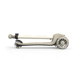 Folded beige Scoot & Ride Highwaykick 3S LED 3-wheel light-up scooter with black accents.