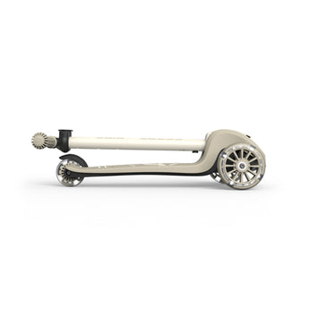 Folded beige Scoot & Ride Highwaykick 3S LED 3-wheel light-up scooter with black accents.