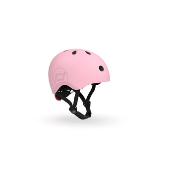 Pink Scoot & Ride kids helmet with black vents, straps, and a red rear light.