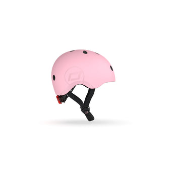 Pink Scoot & Ride kids helmet with black vents, adjustable strap, and red rear light.