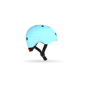 Light blue Scoot & Ride kids helmet with black straps, magnetic fastener, and rear red light.