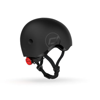 Black Scoot & Ride kids helmet with a red rear light, adjustable straps, and a subtle logo.