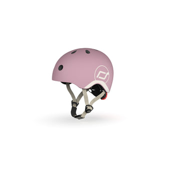 Light pink Scoot & Ride kids helmet with white logo, adjustable straps, and black vents.