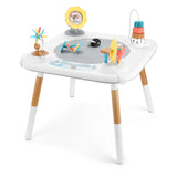 White Skip Hop Discoverosity 3 Stage Activity Center with wooden legs and colorful developmental toys.