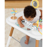 Baby in Skip Hop Discoverosity 3 Stage Activity Center with colorful toys and Discovery Window.