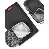 Black Skip Hop Forma quilted diaper bag accessories: changing pad, mesh packing cube, and insulated pouch.
