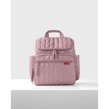 Pink quilted Skip Hop Forma nappy bag backpack with gold zippers and side pockets.