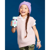 Smiling girl in a purple beanie holding a Skip Hop stainless steel straw bottle with an ice cream design.