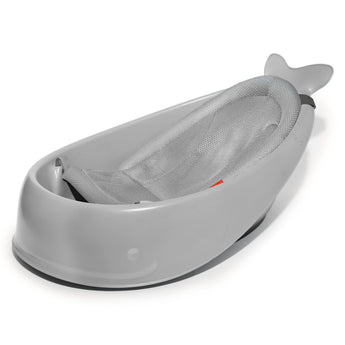 Gray whale-shaped Skip Hop Moby Smart Sling 3-Stage Tub with a light gray mesh sling insert.