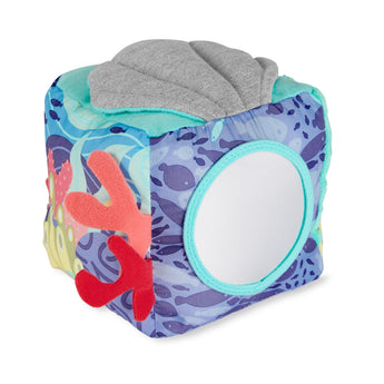 Colorful Skip Hop Seascape soft activity cube with mirror, coral, and shell textures.