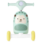 Mint green Skip Hop Zoo 3-in-1 hedgehog ride-on toy with yellow wheels, front view.