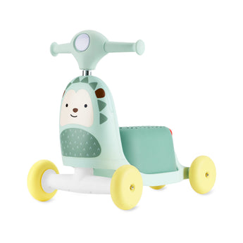 Skip Hop Zoo 3-in-1 mint green hedgehog ride-on toy with yellow wheels, a push walker and scooter.