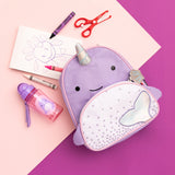 Purple Skip Hop Zoo Narwhal mini backpack with iridescent horn and tail, water bottle, crayons, and scissors.