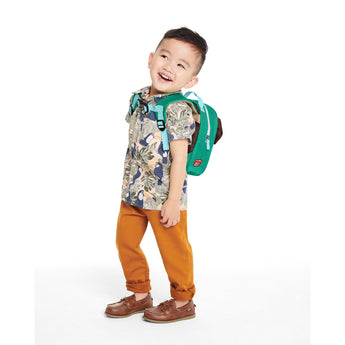Toddler boy wearing a Skip Hop Zoolet Bee Mini Backpack with a green body, brown wings, and blue straps.