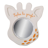 Sophie la girafe Magic Mirror SIGHT White teething toy, shaped like a giraffe head with orange spots and logo.