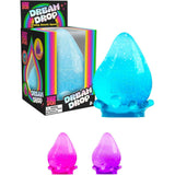 Blue NeeDoh Dream Drop squishy fidget toy, teardrop shape with glitter, on a wavy base.