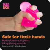 Hand squeezing a translucent, glittery pink NEE DOH Dream Drop squishy fidget toy.