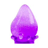 Purple NEE DOH Dream Drop squishy fidget toy with glitter, shaped like a teardrop, on a matching base.