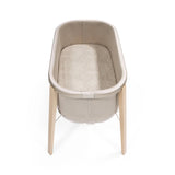 Stokke Snoozi Fitted Sheet lifestyle in bassinet