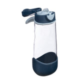 Clear water bottle with a dark blue base and cap on a white background