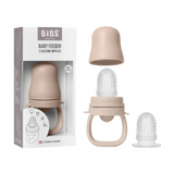 Sage BIBS Baby Feeder with two silicone nipples, shown in packaging and disassembled.