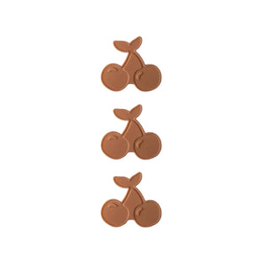 Three pairs of cherry-shaped icepacks on a white background
